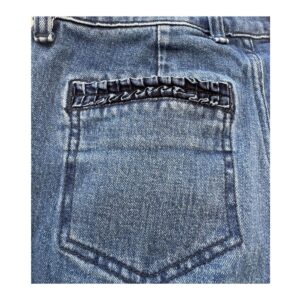 jeans flare inspiración setentas talla 25 en denim azul con bolsillos artesanales de 7 for All Mankind, silueta alargada y estilo atemporal