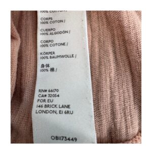 T-shirt You Rock de Free People color durazno, corte crop relajado y costuras visibles, talla S, ropa usada, de segunda mano