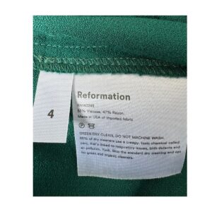 Mono largo verde esmeralda de Reformation con silueta palazzo, mangas abullonadas y espalda descubierta con lazada, talla 4. segunda mano