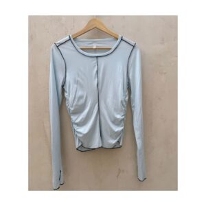 Top de free people movement en color azul con remates en negro , talla s. Athleisure.