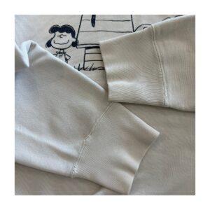 Pullover Uniqlo colaboración Peanuts en 100% algodón